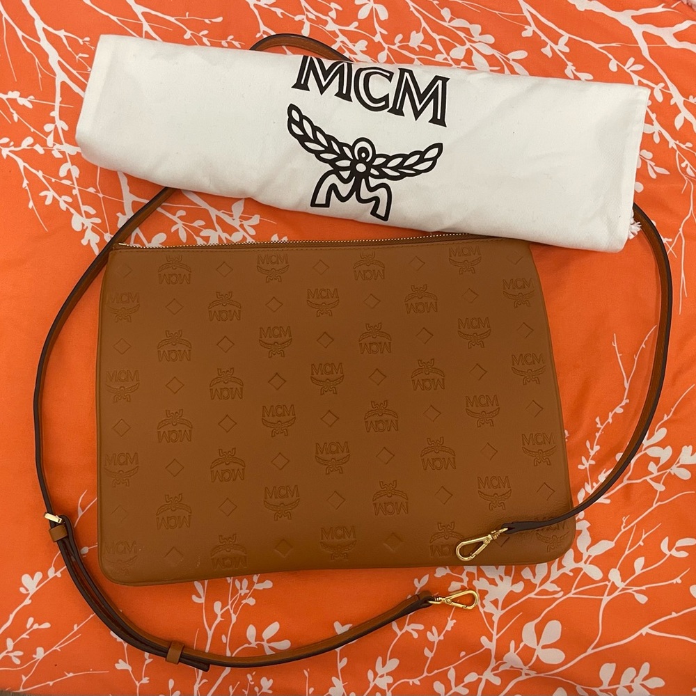 MCM —Aren Crossbody Pouch in Monogram Leather.